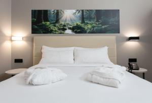Postel nebo postele na pokoji v ubytování Break Hotel + 37 fotografií
