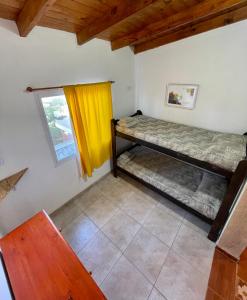 two bunk beds in a room with a window at Costa Clara Hotel in Santa Clara del Mar +43 photos