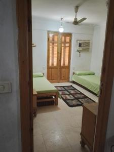A bed or beds in a room at Adad Noubian House