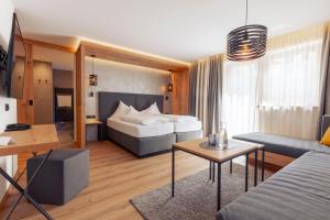 Ένα ή περισσότερα κρεβάτια σε δωμάτιο στο Hotel Mondin