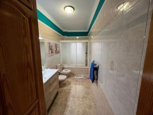 a bathroom with a tub and a toilet and a sink at La Casita de Omar en el corazón de Anaga y La Laguna in Las Mercedes +50 photos