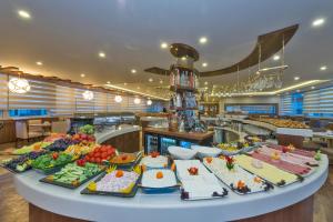 a buffet table with many different types of food at Bekdas Hotel Deluxe & Spa in Istanbul