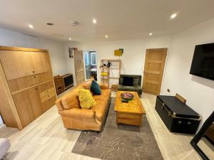 a living room with a couch and a table at Keeley House in Exeter