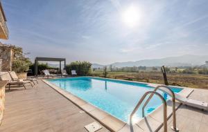 a swimming pool with a view of the mountains at Lovely Home In Castiglione Del Lago in Castiglione del Lago +46 photos