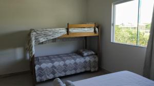 Voodi või voodid majutusasutuse Barra de Jacuípe - Condomínio Parque Jacuípe -Mansão Caldeira toas +51 fotot