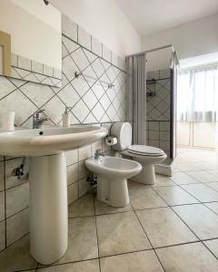 a bathroom with a sink and a toilet at La Casa dei Mori in Centuripe +99 photos