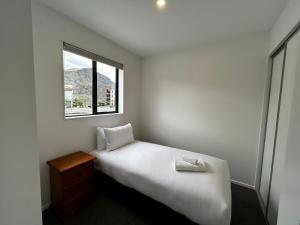 Postel nebo postele na pokoji v ubytování Swiss-Belresort and Villas Coronet Peak
