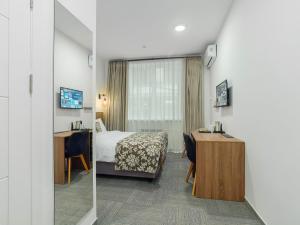 Televiisor ja/või meelelahutuskeskus majutusasutuses TA Collection Hotel