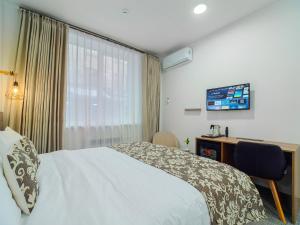 Televiisor ja/või meelelahutuskeskus majutusasutuses TA Collection Hotel