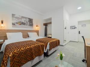 Voodi või voodid majutusasutuse TA Collection Hotel toas