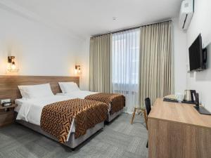 Postel nebo postele na pokoji v ubytování TA Collection Hotel + 37 fotografií