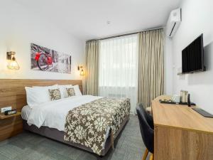 Televiisor ja/või meelelahutuskeskus majutusasutuses TA Collection Hotel