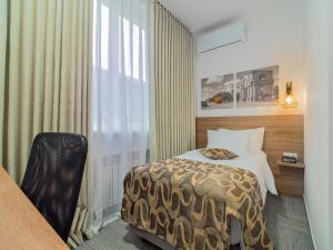 Voodi või voodid majutusasutuse TA Collection Hotel toas