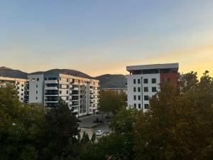 a group of apartment buildings in a city at Apartment Lola in Trebinje