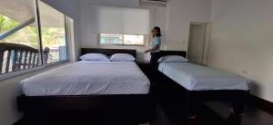 Hotel Marielos客房内的一张或多张床位