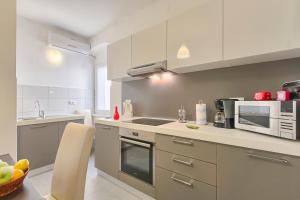 Kuchyň nebo kuchyňský kout v ubytování Apartment Spagnolo City