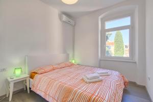 Postel nebo postele na pokoji v ubytování Apartment Spagnolo City