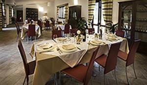 a dining room with a long table and chairs at Villa Giovina in Pratola Peligna