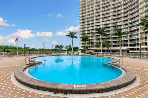 a large swimming pool in front of a large building at La Bella Vita on Marco - 1801 South Seas Tower 3 in Marco Island