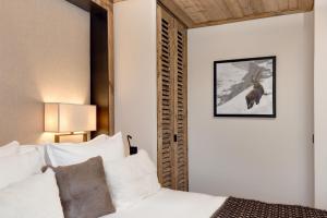 Ένα ή περισσότερα κρεβάτια σε δωμάτιο στο Antarès STELLA 001 - Ski inski out apartment