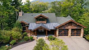 an overhead view of a log home with a gambrel at Rustic & Comfy Retreat Elevator - Hot Tub - Games in Lincoln
