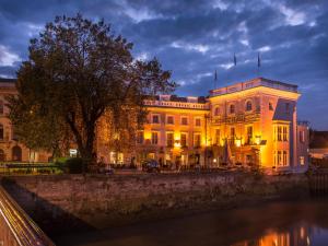 a large white building with lights on it at night at The White Hart Hotel, Boston, Lincolnshire in Boston