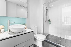 a bathroom with a sink and a toilet and a shower at Barkly Beachside Escape in Melbourne +21 photos