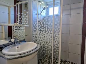 a bathroom with a sink and a shower at Chalet familial avec grand jardin et équipements pour enfants, à 500m du centre de Ban-sur-Meurthe - FR-1-589-33 in Ban-sur-Meurthe-Clefcy +12 photos