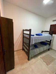 a bedroom with two bunk beds in a room at Gostoso beach House pool in São Miguel do Gostoso