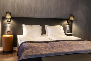 Postel nebo postele na pokoji v ubytování K7 Hotel Oslo
