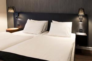 Postel nebo postele na pokoji v ubytování K7 Hotel Oslo