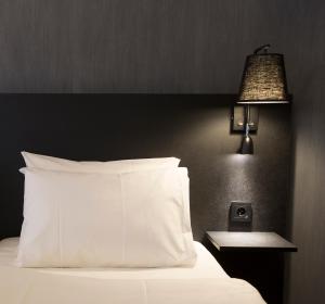 Postel nebo postele na pokoji v ubytování K7 Hotel Oslo