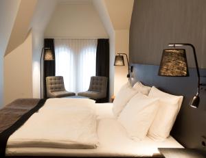 Postel nebo postele na pokoji v ubytování K7 Hotel Oslo