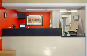 a lobby with a melgage sign on a counter at Extended Stay America Suites - Seattle - Southcenter in Tukwila