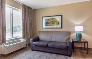 a living room with a couch and a window at Extended Stay America Suites - Fairbanks - Old Airport Way in Fairbanks