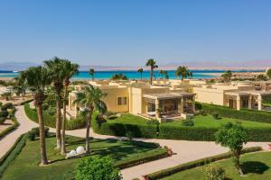 an aerial view of a house with palm trees at Sheraton Soma Bay Resort in Hurghada