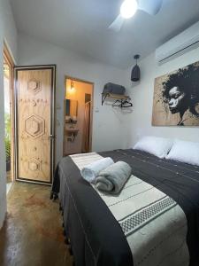 a bedroom with two beds in a room with a door at Akoma San Pancho in San Francisco