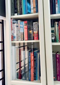 a book shelf filled with lots of books at D Ocean Homestay in Seri Manjung