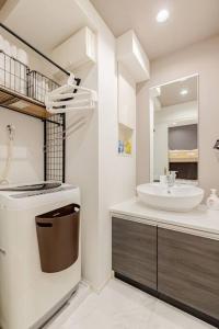 a bathroom with a sink and a toilet and a mirror at residence MINAMI-AOYAMA102 in Tokyo +57 photos
