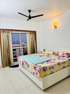 a bedroom with a bed and a window at 6Floor in society Ecity ph2 Near TCS Tech Mahindra in Bengaluru +31 photos