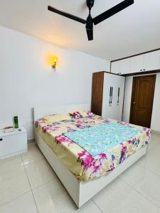 a bedroom with a bed in a white room at 6Floor in society Ecity ph2 Near TCS Tech Mahindra in Bengaluru