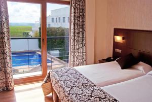 Postel nebo postele na pokoji v ubytování Hotel Andalussia