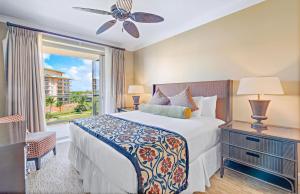 a bedroom with a bed and a window at Honua Kai Resort And Spa By Maui Resort Rentals in Lahaina