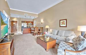 a living room with a couch and a table at Honua Kai Resort And Spa By Maui Resort Rentals in Lahaina