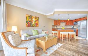 a living room with a couch and a table at Honua Kai Resort And Spa By Maui Resort Rentals in Lahaina
