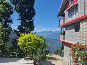 a view of the mountains from a building at Room in Kalimpong in Kalimpong