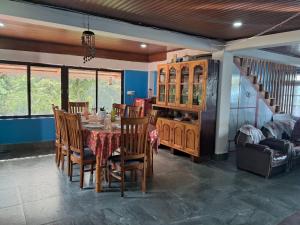 a dining room with a table and chairs at Room in Kalimpong in Kalimpong
