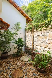 Ein Garten an der Unterkunft Green Bay Phu Quoc Resort & Spa