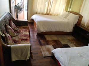 Letto o letti in una camera di Kathmandu Airport View Hotel And Lodge