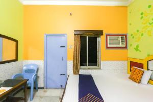 Voodi või voodid majutusasutuse Hotel O Bideshini Hotel toas